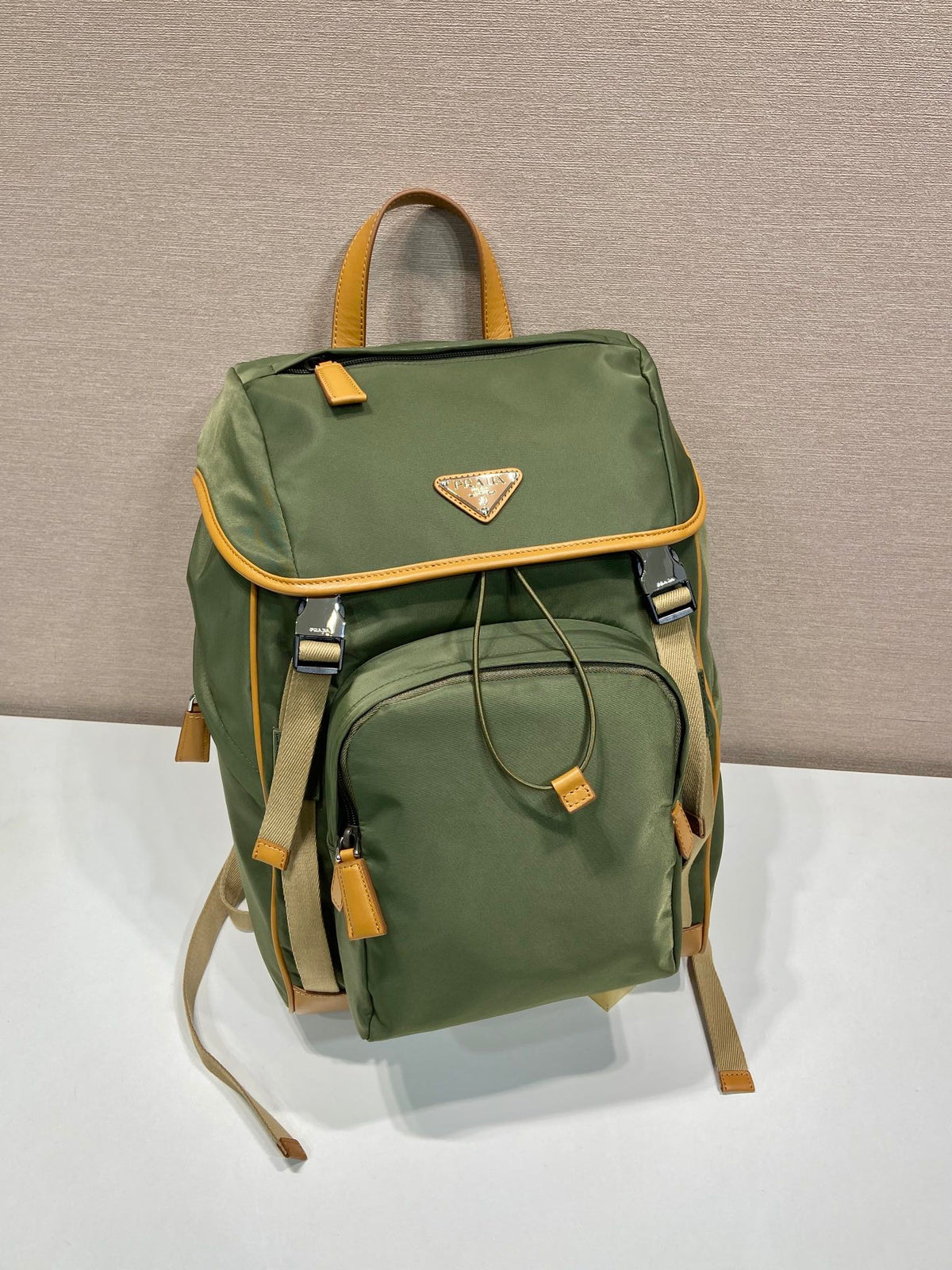 PRADA BACKPACK 45 IN SEAWEED GREEN RE-NYLON AND BROWN CALFSKIN TRIM