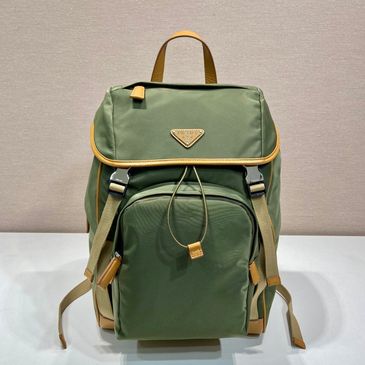 PRADA BACKPACK 45 IN SEAWEED GREEN RE-NYLON AND BROWN CALFSKIN TRIM