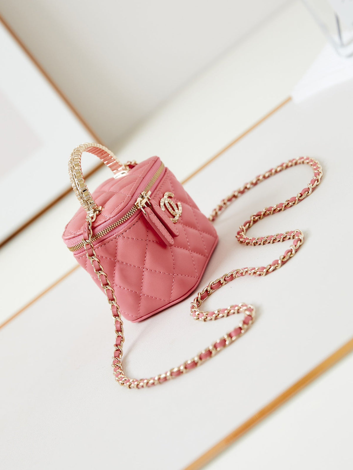 CHANEL 25S MINI VANITY BAG 11 CM IN PEACH PINK LAMBSKIN WITH CRYSTAL-EMBELLISHED  LOGO