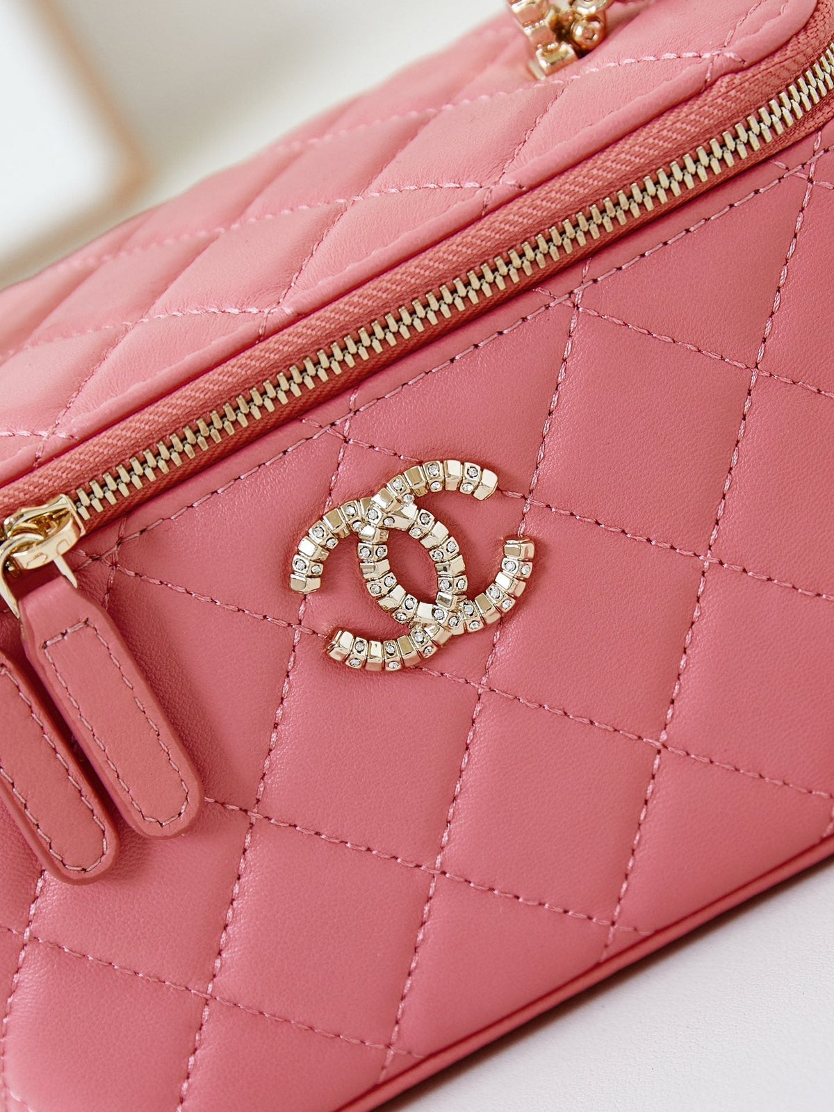 CHANEL 25S MINI VANITY BAG 16 CM IN PEACHY PINK LAMBSKIN WITH CRYSTAL-EMBELLISHED  LOGO
