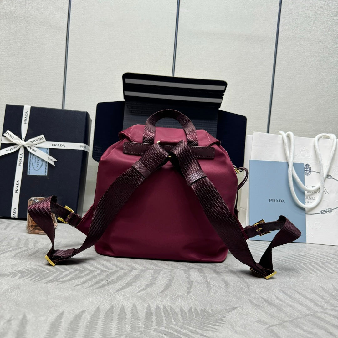 PRADA 25S RE-EDITION 1978 SMALL BACKPACK 28 IN BURGUNDY RE-NYLON