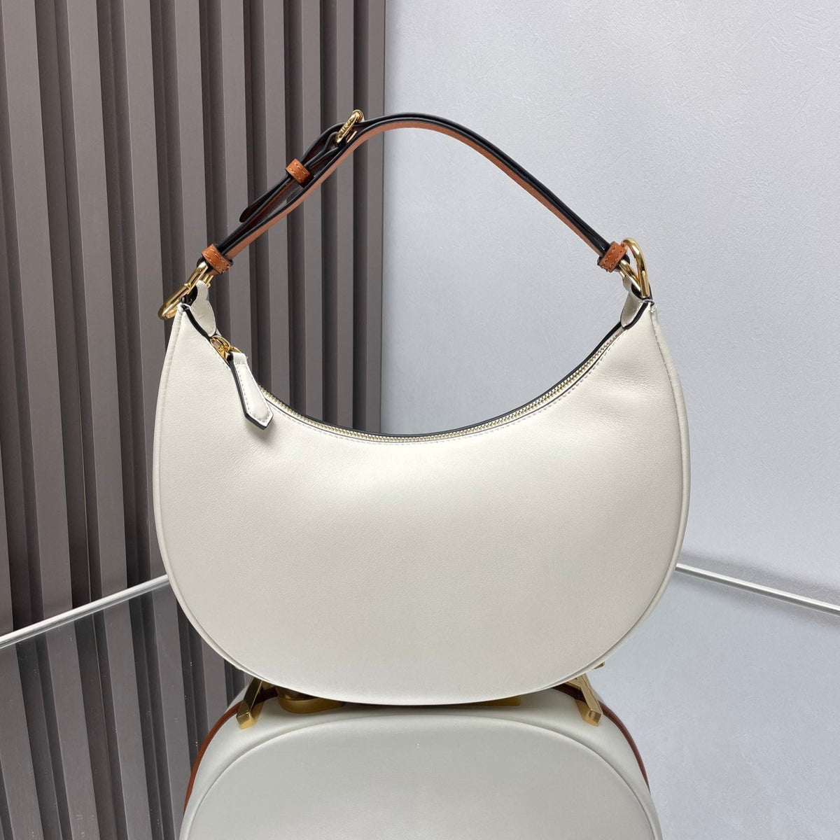 FENDIGRAPHY MEDIUM 29 IN WHITE AND ORANGE TRIM SMOOTH LAMBSKIN GOLD HARDWARE
