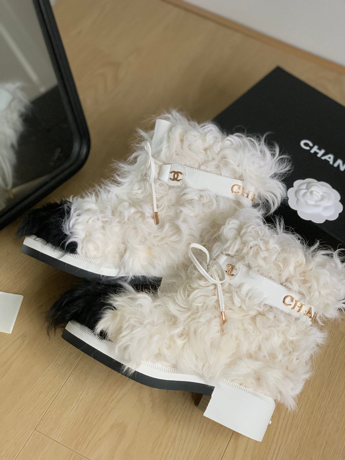 CHANEL ANKLE BOOTS IN WHITE MIX BLACK WOOL FUR