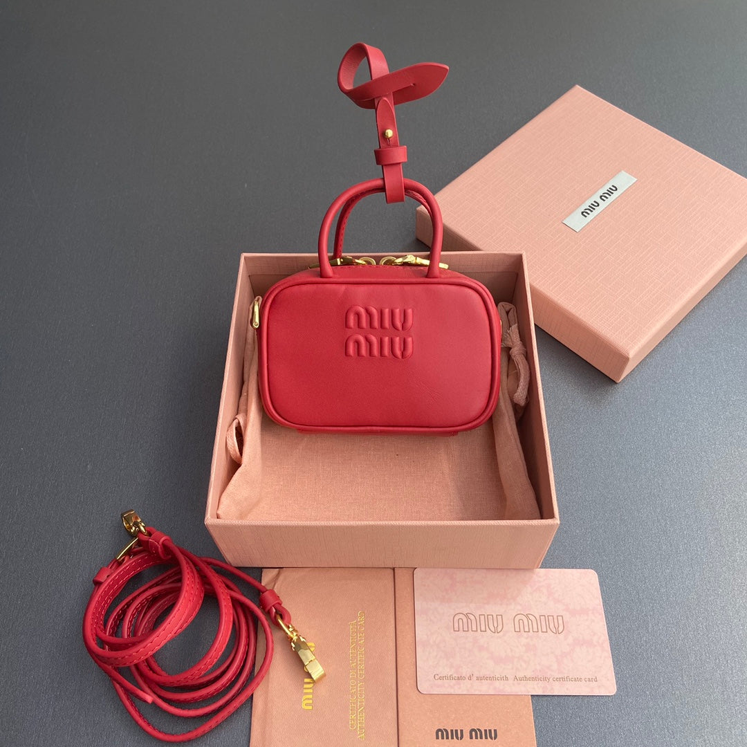 MICRO BAG KEYCHAIN 11 IN TALL POPPY RED CALFSKIN EMBOSSED LOGO